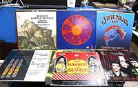 Photo showing six record albums including Berlioz 'Harold in Italy', KRLA 42-Solid Rocks compilation, Steve Miller Band Greatest Hits, choir music, Barber of Seville, and a classical/chamber music album.