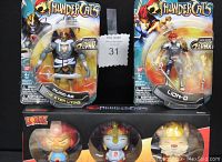Photo showing sealed Mumm-Ra and Lion-O Thunder Lynx action figures and boxed Dorbz ThunderCats vinyl figure set.