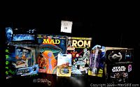Photo showing all 7 items of the 'Syfy' gift set including Black Panther pin, Battleship Earth figure, MAD magazine, ROM comic, Avatar figurine, Star Trek key chain clock, and Star Wars toy.