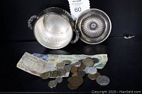 Leonard silver-plated bowl with lid displayed with coins and paper money spread in front