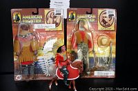 Photo of lot showing two boxed action figures of Geronimo and Wyatt Earp, along with loose Native American chief figure riding brown horse figure with white mane and tail.