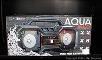Front view of the new boxed TECH2 Aqua Maxx Bluetooth speaker with water splash graphic and product branding.