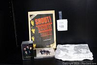 Complete lot in a display with the SHOUT! Beatles book excerpt in the background, Beatles Real Love CD, trading cards in clear box, and folded Beatles T-shirt with member faces