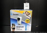 Front view of the Swann Viewcam Wi-Fi Camera box showing branding and key features including HD video and Wi-Fi connectivity.