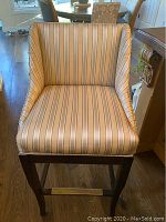 Front view showing striped upholstery, seat depth and backrest design