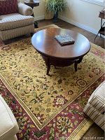 Area rug under coffee table in living room
