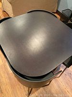 Table with chairs tucked underneath showing overall footprint and design