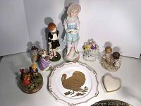 Overview of the lot including all figurines, the Lenox heart box, and the music box.