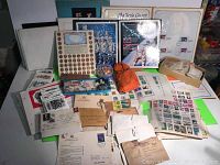 Overall view of lot showing binders, loose stamps, covers, display boards