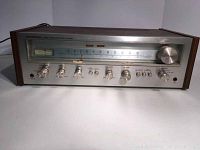 Front view of Pioneer SX-550 stereo receiver showing all controls and AM/FM radio dial.