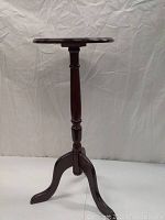 Front view of the small cherrywood end table against a plain background.