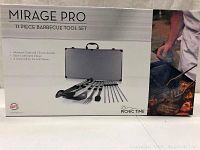 Box image showing brand Mirage Pro 11 piece barbecue tool set with aluminum case, chrome accents, and black leatherette interior.