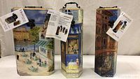 Lot of three artist wine boxes with handles and scenic paintings on each.