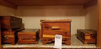 Five cedar boxes shown side by side on shelf, natural wood color, varying sizes