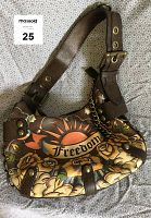 Brown leather Isabella Fiore shoulder handbag with adjustable strap and hand painted floral and sun pattern featuring 'Freedom' text.