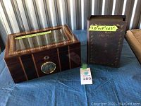 Wooden humidor and War and Peace book box side by side showing size and details.