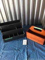 Photo of wooden P&G Ivory Soap container and black desk organizer on blue fabric background.