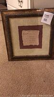 Framed art picture with 'Faith' inspirational quote showing ornate gold-tone frame and textured matting.
