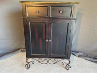 Front-facing view showing overall cabinet design and drawer and door arrangement