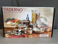 Front of retail box showing Paderno Alberton logo, plated cookware lineup and 11-piece count