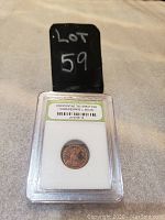 Photo of the obverse side of the Roman Empire coin from Constantine the Great era encased in protective plastic.