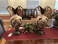 Pair of vases on table under natural light