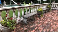 Three planters arranged on brick patio with balustrade backdrop