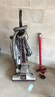 Full view of Kirby Legend vacuum cleaner upright with hoses and several attachments arranged near it, showing condition and included parts.
