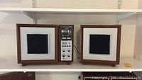 Full view of Panasonic stereo model RE-787 with two wooden frame speakers on each side, showing the overall set.