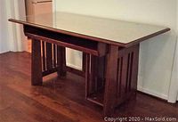 Full front view of desk showing glass top and pull-out tray