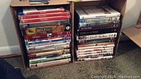 Photo showing two stacked boxes filled with various DVD movies and TV show titles.