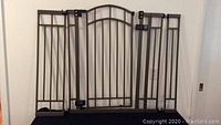 Full view of Summer multi use metal safety gate with two extension panels, showing design and mounting hardware