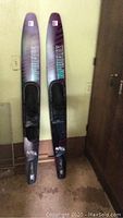 Full view of the pair of Taperflex Astra CT 3000 waterskis showing bindings and length.