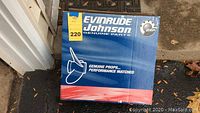 Blue Evinrude Johnson branded box with Genuine Parts logo, showing product name and BRP logo.