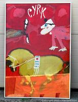 Full view of framed poster leaning against wall