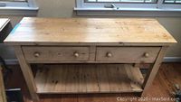 Front view of wood sofa table showing full length and drawer placement.