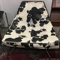 Front view of chair showing vinyl cushion and bentwood frame