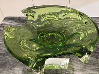 Top view shows the thick green glass, curvy organic shape, and overall design of the bowl.