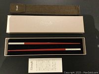 Original box, chopsticks in place, pouch and pamphlet displayed