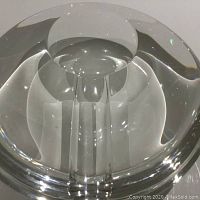 Top view of the clear heavy glass dish with internal cylindrical and pillar structures, showing transparency and thickness of the glass.