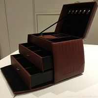 Front and side view showing the 3 extended tiers with multiple compartments and ring holders.