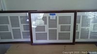 Set of three dark wood finish photo frames with divided sections under glass, each approximately 20" x 26"