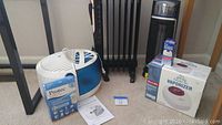 Full lot image showing Family Care vaporizer, humidifier box, heater, and filter box on floor