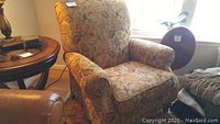 Full front view of recliner chair showing upholstery pattern and shape