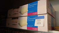 Two new in-box Tempur-Pedic Symphony Pillows stacked, showing brand and product details on box.