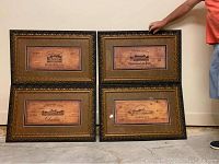 Four framed wine themed prints with vintage wine label images in black and gold frames, showing set contents and size comparison with person.