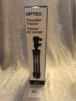 Photo of the Optex Traveller Tripod in its original box with product branding and specifications visible.