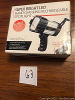 Photo of the boxed Super Bright LED Hand Cranking Rechargeable Spotlight with front label visible showing product name and features