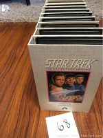 View of 22 Star Trek The Collector's Edition VHS tapes stacked vertically showing box set spines.