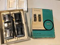 Pair of vintage Ross walkie talkies in original packaging box with protective foam inserts